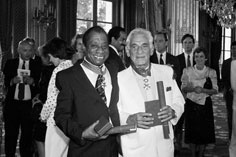 Baldwin and Leonard Bernstein holding their Legion d'Honneur awards